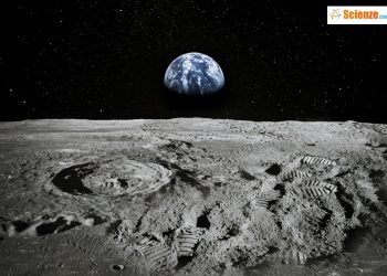 Il suolo lunare e sullo sfondo la Terra